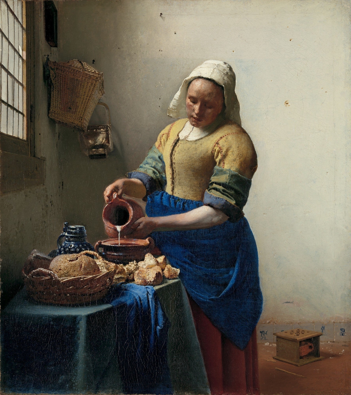 Cô gái rót sữa. Tác giả: Johannes Vermeer
 